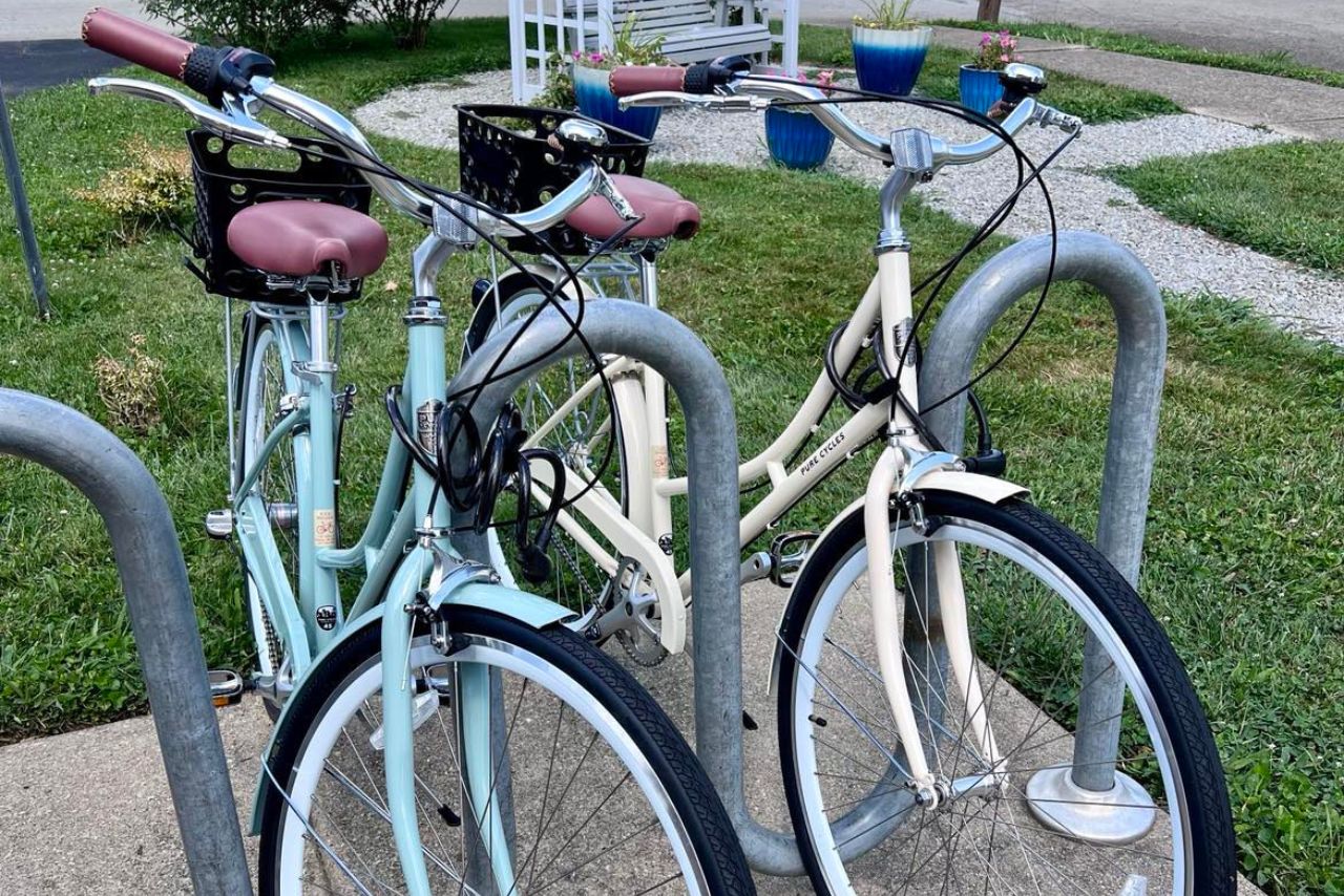 Two bikes in bike rack.
